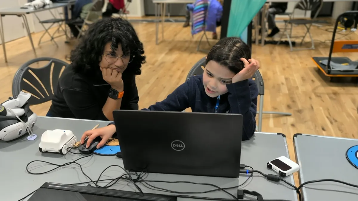 Mentor supporting a young coder at Bishop's Stortford